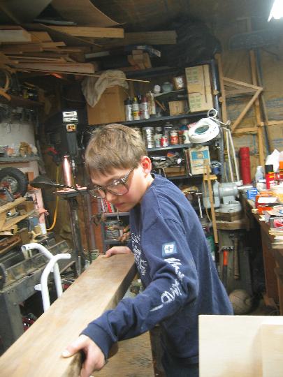 IMG_4996.jpg - It takes concentration to smoothly push the wood through the saw.