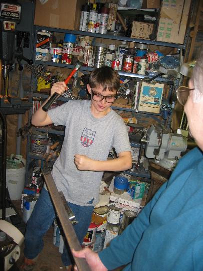 IMG_5032.jpg - Knocking the castors off the old bed frame.